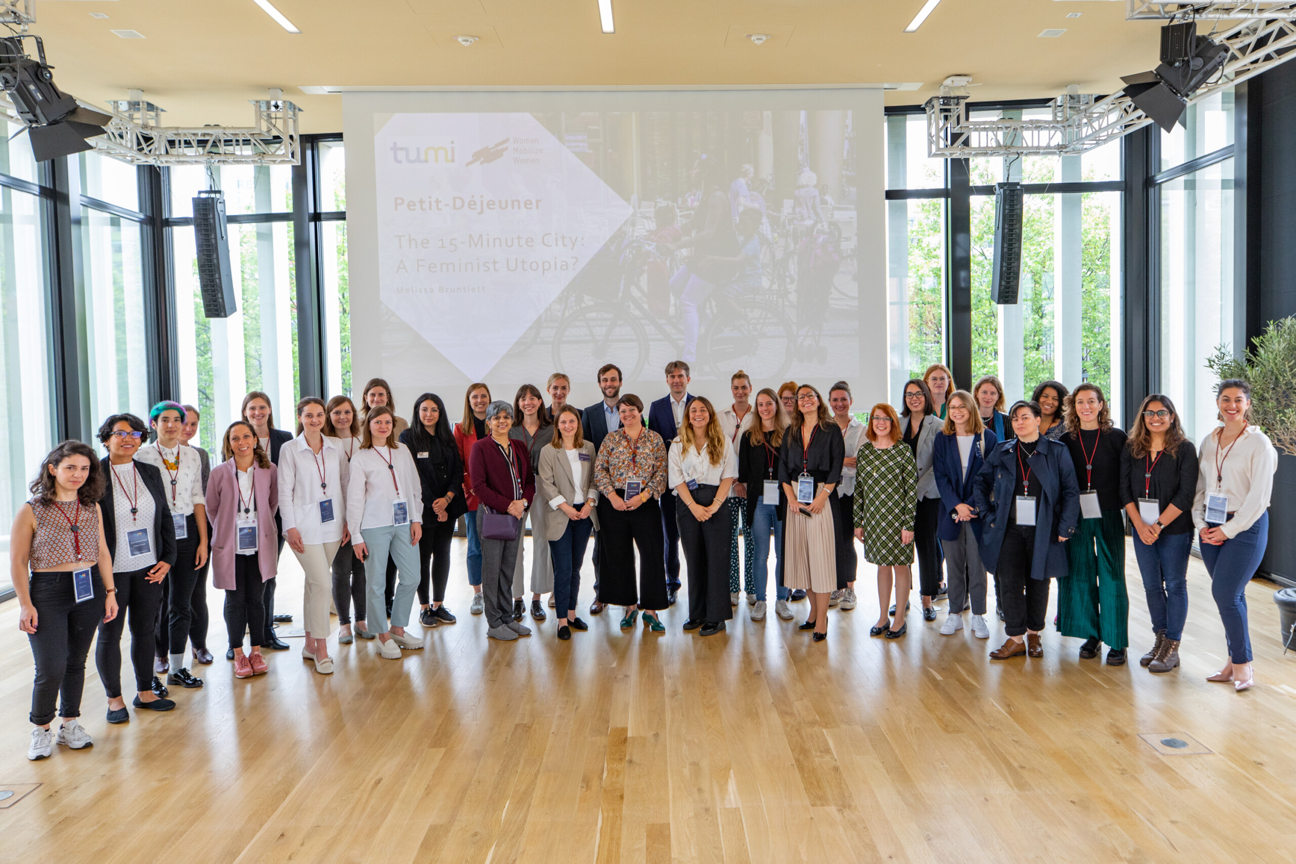 Melissa Bruntlett (center) with 30 others at the Women Mobilize Women Petit Dejeuner 2022
